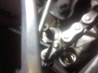 Loosening the stock arm bolt with an 8mm Allen wrench