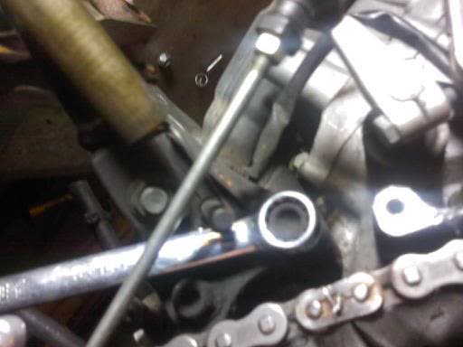 Wedging a socket to loosen the bracket