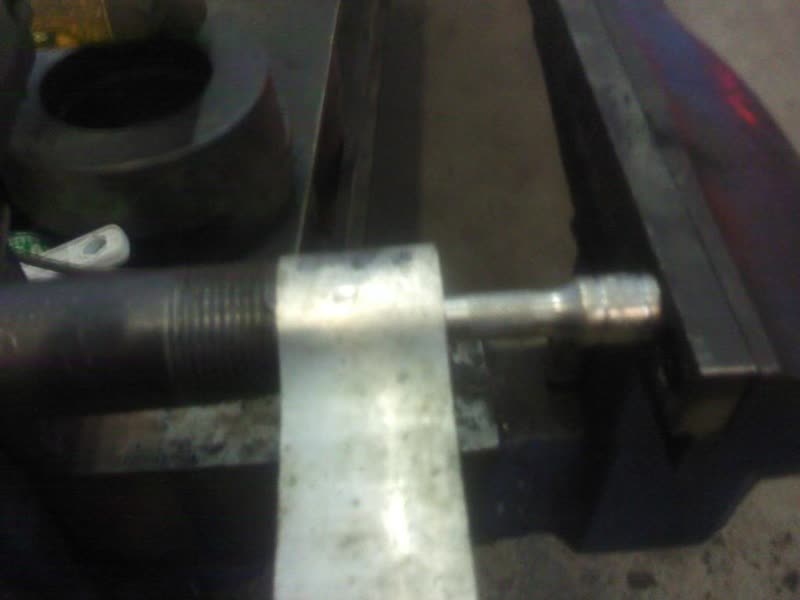 Pressing out the stock bearing in a vise